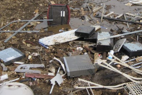 15 surprising e waste facts - a rubbish site with several e-waste items that haven't been recycled correctly.