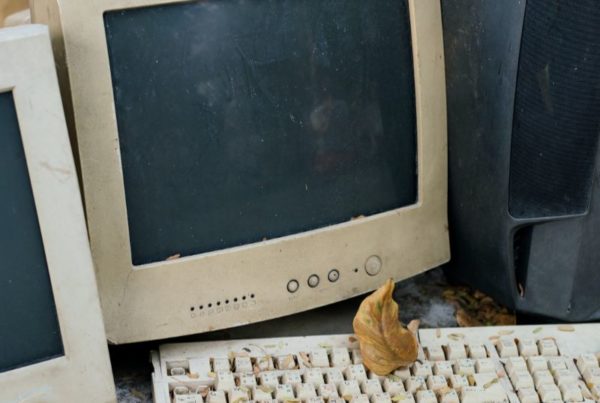 An old computer monitor and keyboard.